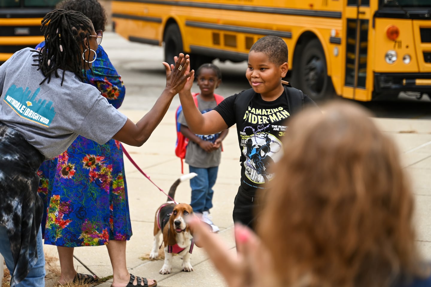 ‘Have a great day’: School 51 welcomes students to the new year with cheers and high fives