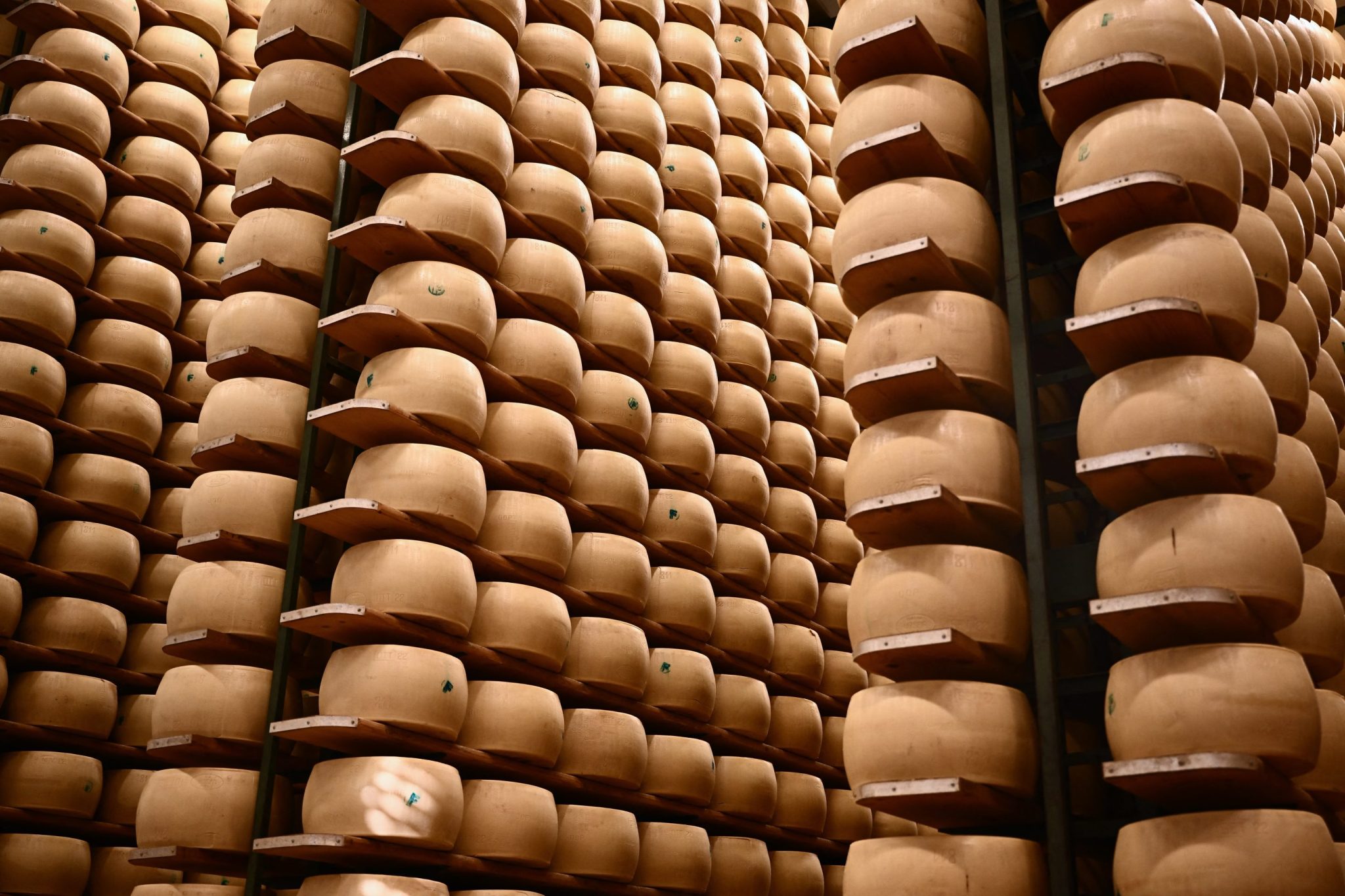Italy’s $4.7 billion cheese economy is feeling the heat as climate change threatens its cheese banks that hold Parmigiano wheels as loan collateral