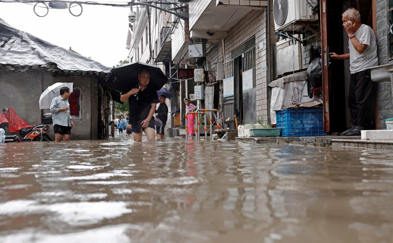 Typhoon Dolphin's vast storm system pushes inland, threatens central China