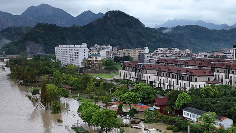 Typhoon Dolphin's vast storm system pushes inland, threatens central China