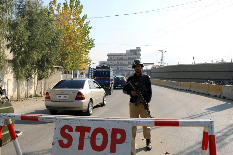 Suspected suicide bombing at police station kills at least 14 in Pakistan, officials say
