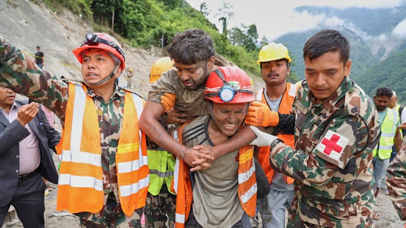Two Australians found safe in Nepal as two trapped workers rescued from tunnels