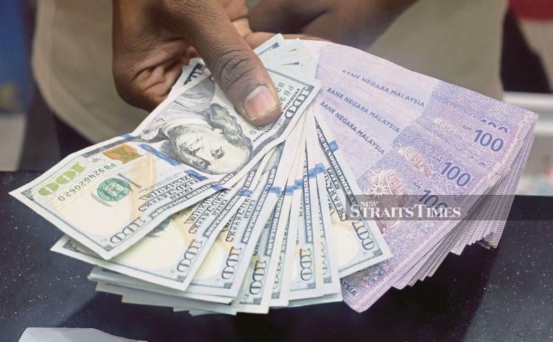 Ringgit higher against major currencies, eases against greenback at close