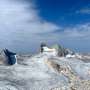 Why some Alaskan rock glaciers race downhill while their neighbors barely move