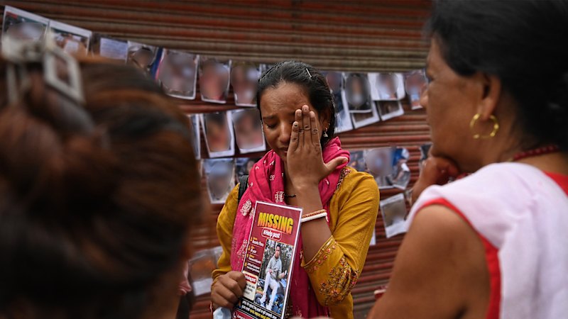 In Nepal, families look for loved ones, but dread what they will find