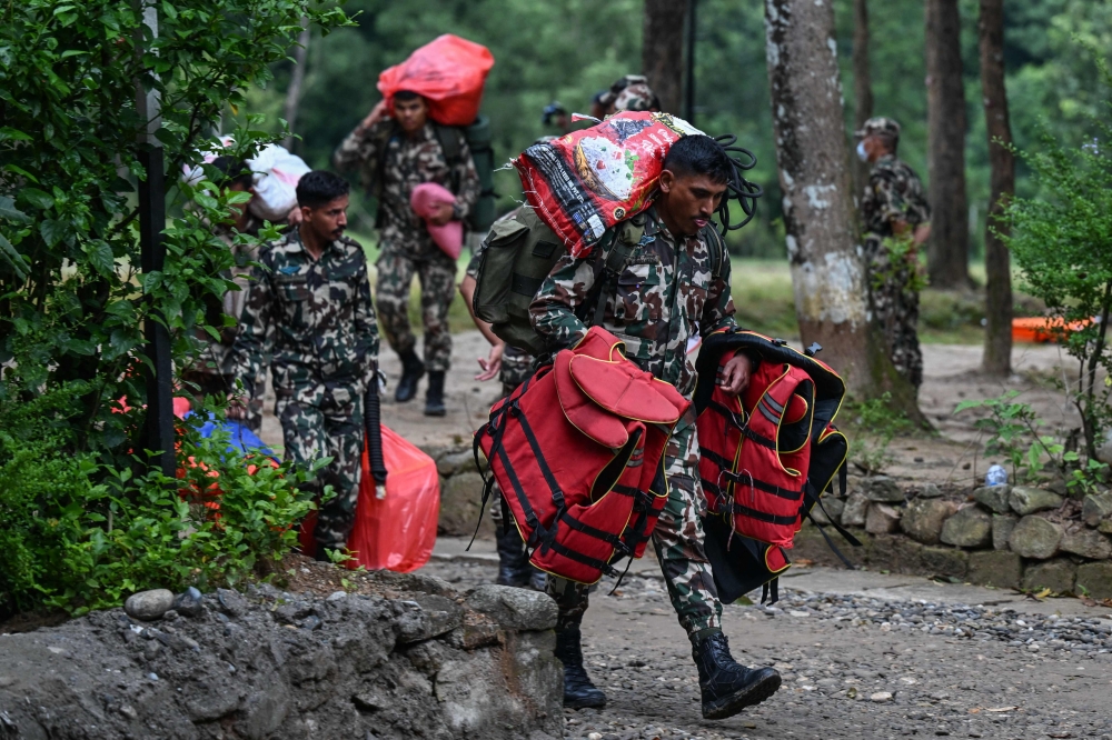 Nepali woman rescued alive after 10 days under flood debris