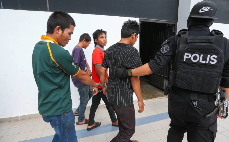 Two brothers among four charged with murder in oil palm plantation