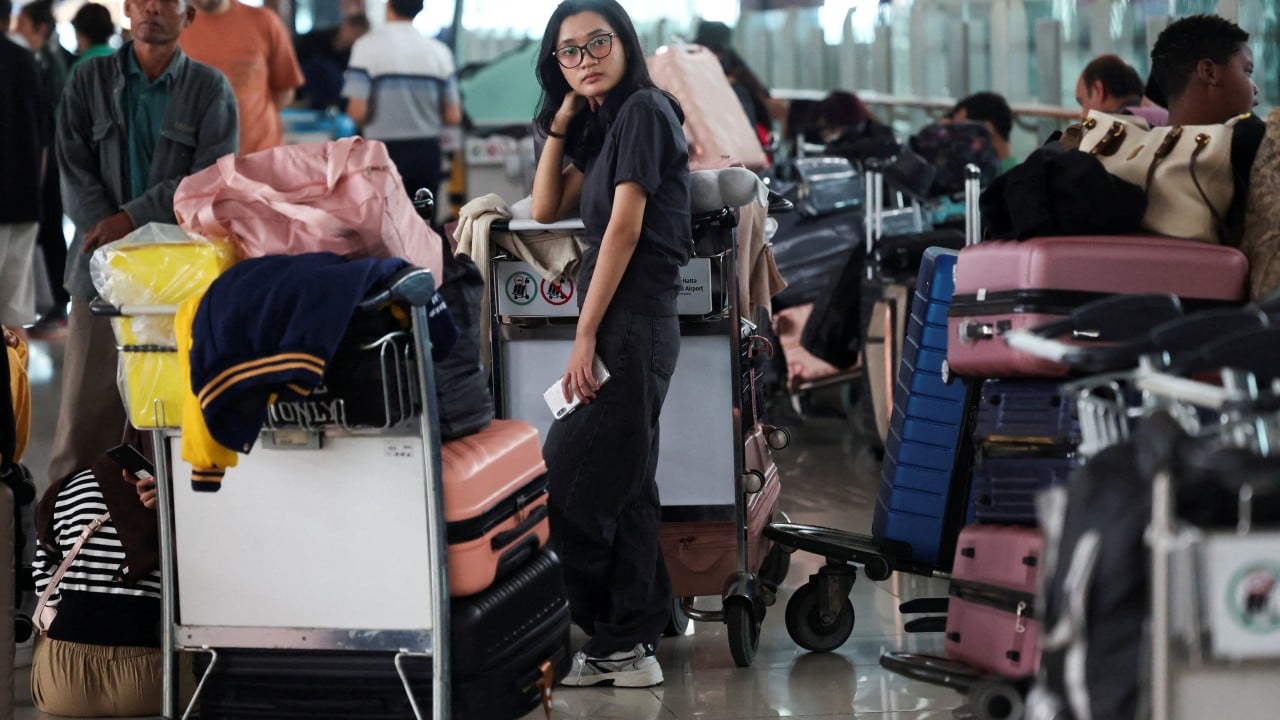 Jakarta airport and others reopen after volcanic ash crisis in Indonesia