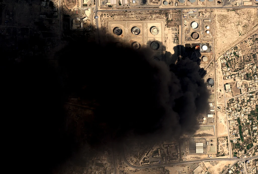 Drone strikes hit Libya's key western oil town as a car bomb kills an officer in the east