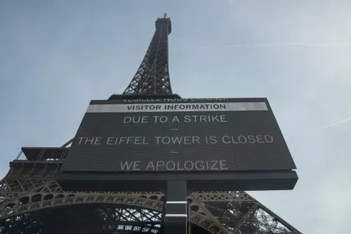 Eiffel Tower reopens after spat over removing women staff