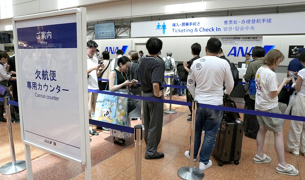 Tropical storm hits Tokyo area, leaving thousands without power before moving west