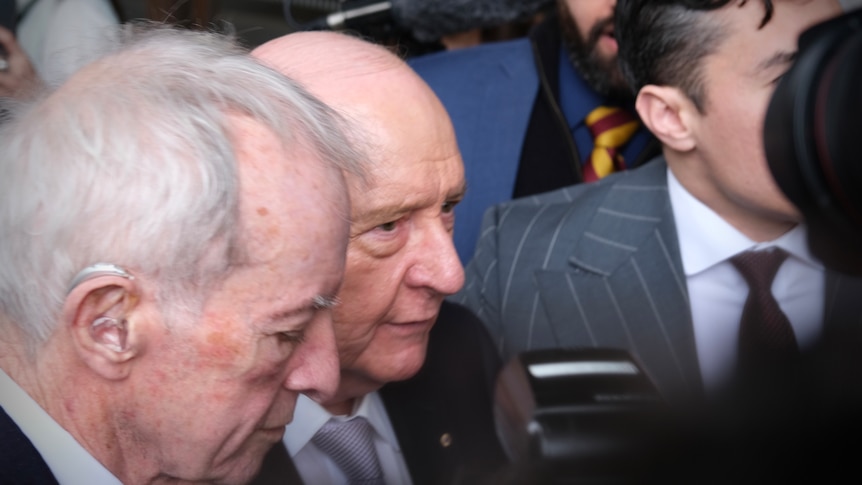 Alan Jones arrives for indecent assault, sexual touching trial