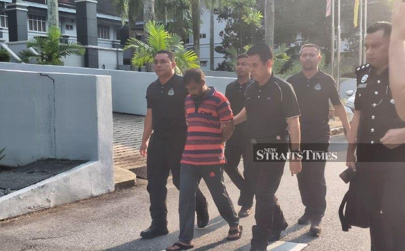 Bangladeshi man charged with murder of three compatriots