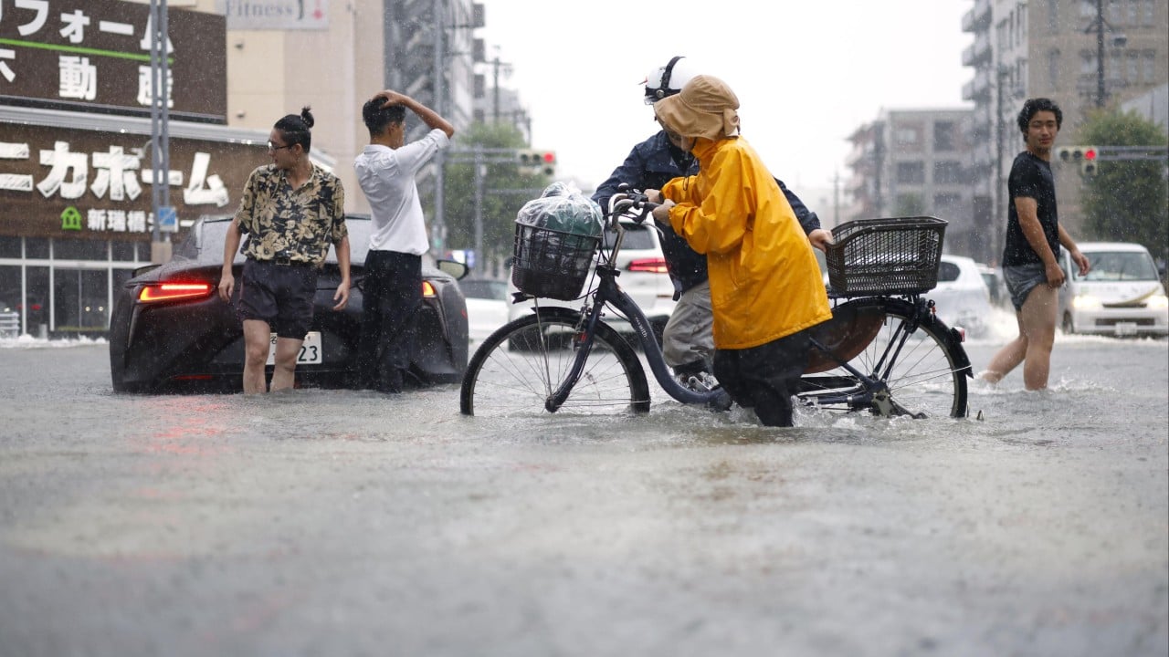 Japan’s Nagoya reels from record rain, stranding commuters and flooding city
