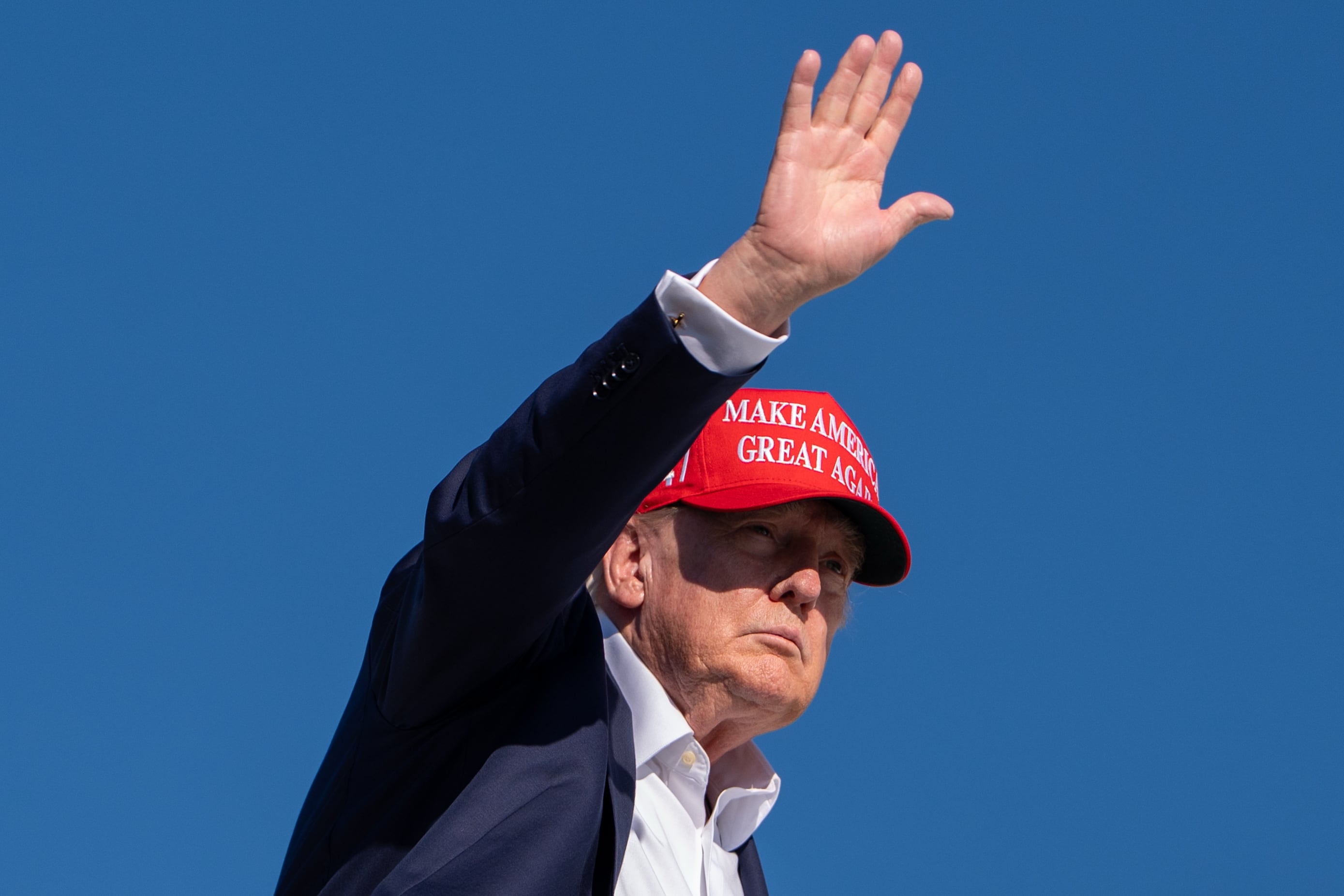 Trump escalates trade war with ban on purchase of Canadian spirits and motorcycles