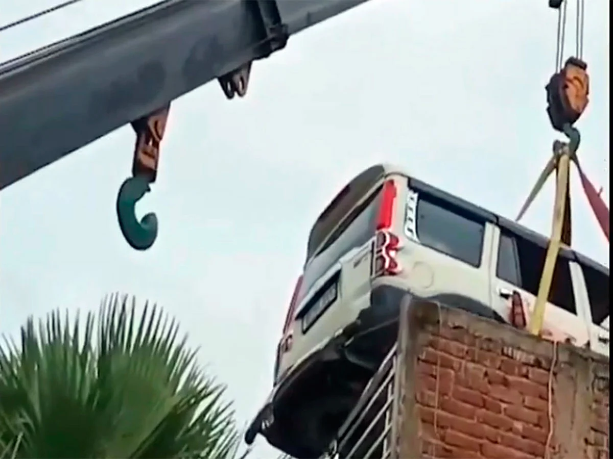 SUV parked on house roof goes viral — carmaker's boss reacts