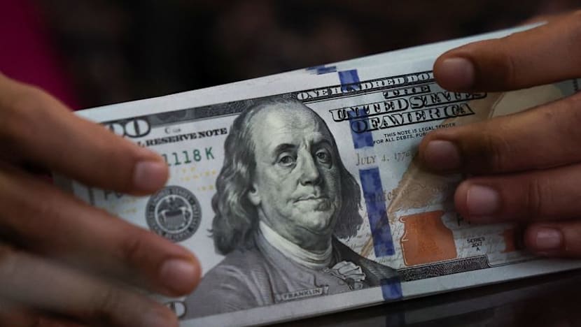 Dollar ticks up on Iran tensions, with US data in focus