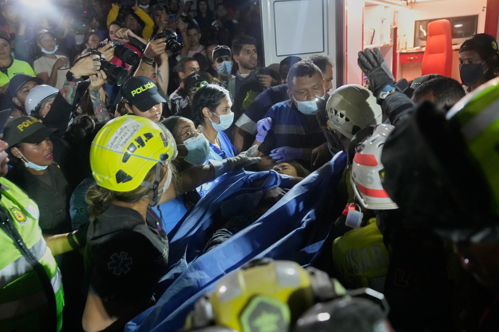 Colombia rescuers find woman alive as quake death toll passes 200