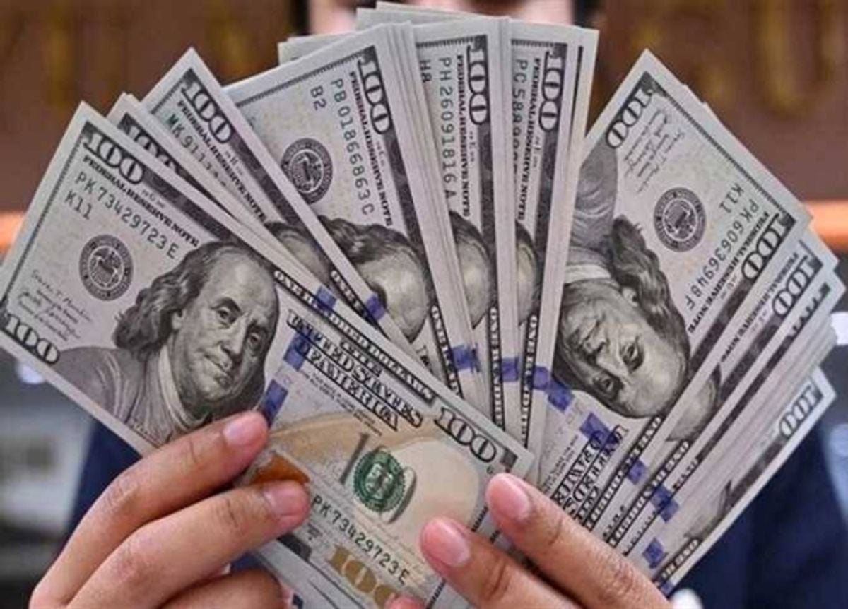 Dollar holds steady as markets await US inflation data