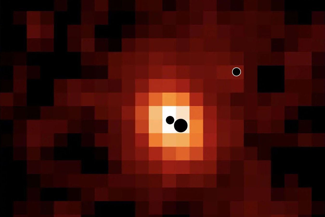 Three black holes discovered in a young galaxy for the first time