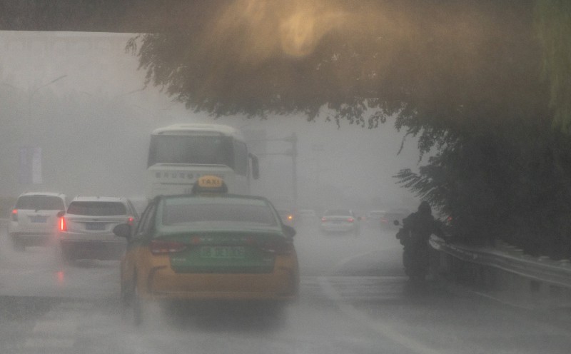 Rain pounds Beijing as Typhoon Dolphin sweeps through China