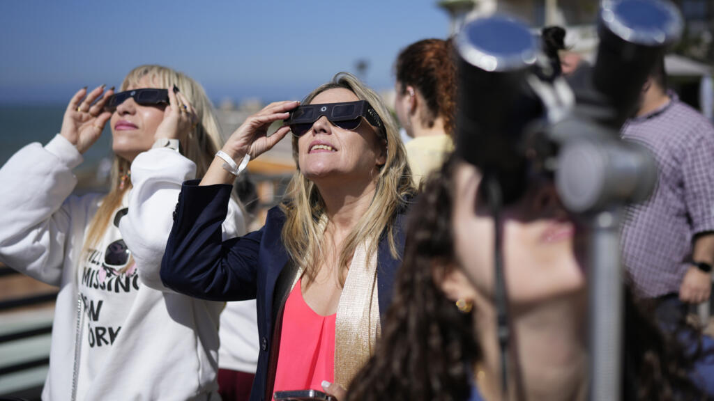 Live: Millions of skywatchers in Europe prepare for total solar eclipse