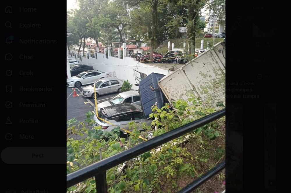 Rubbish lorry crashes through Pantai Hillpark condo wall, crushes three cars