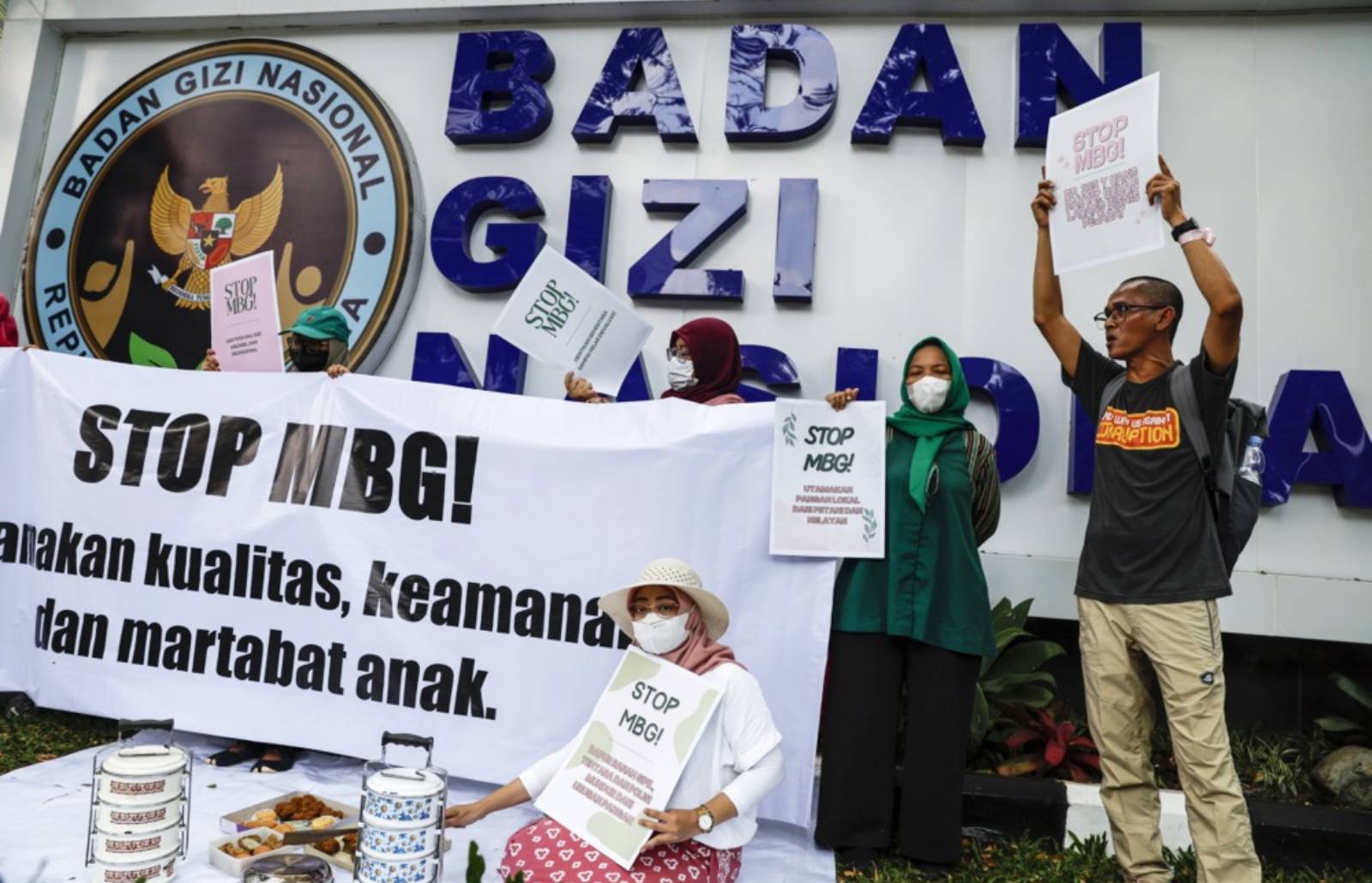 Parents of Indonesian children sickened by free school meals file police complaint