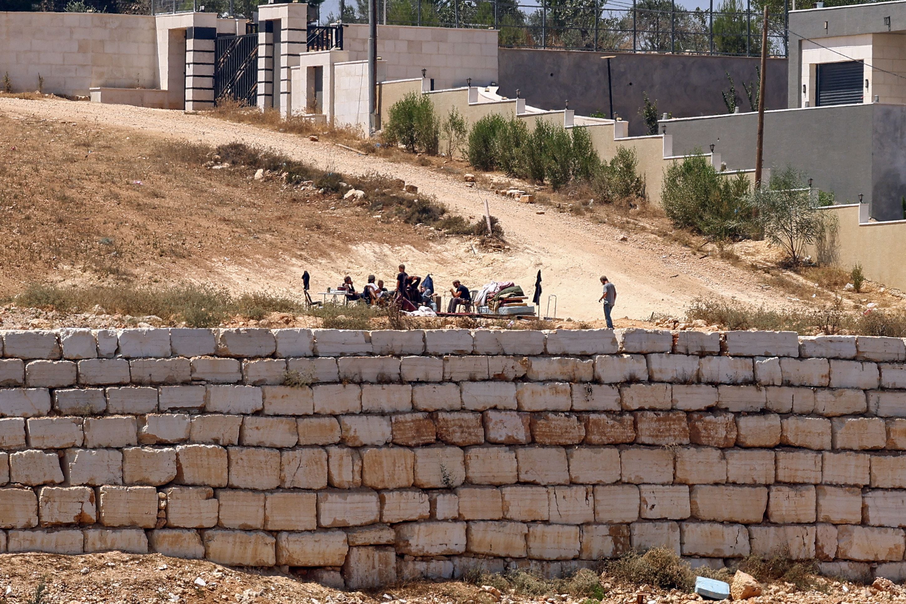 Settlers maintain siege of Palestinian homes in West Bank as army withdraws