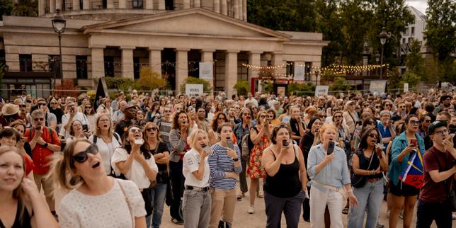 Céline Dion's 'giant karaoke' brings together Paris fans in song