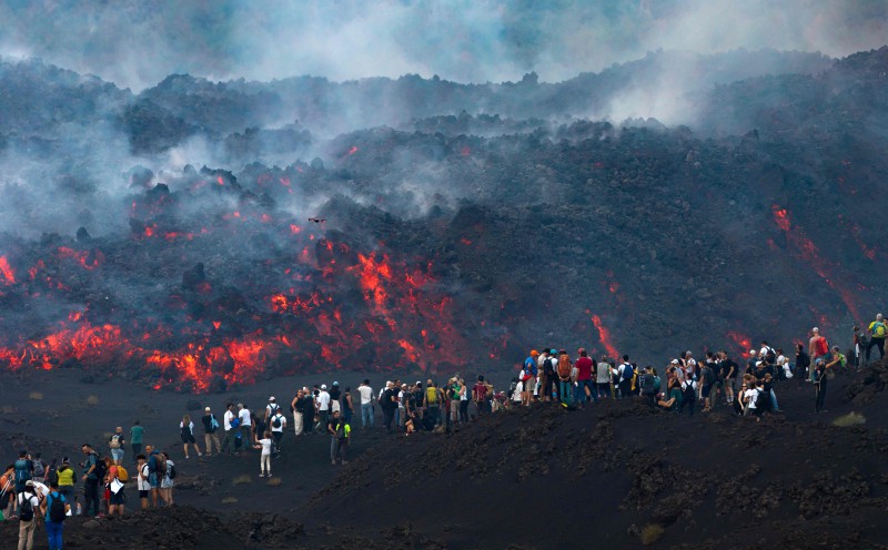 Tourists rush to Mount Etna as Italian volcano erupts