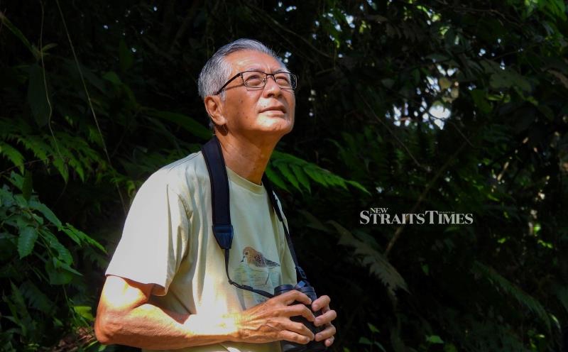 A bucket hat, binoculars and a remarkable Malaysian conservation legacy