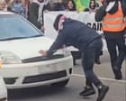 Driver allegedly rams into protester at Melbourne anti-racism rally – video