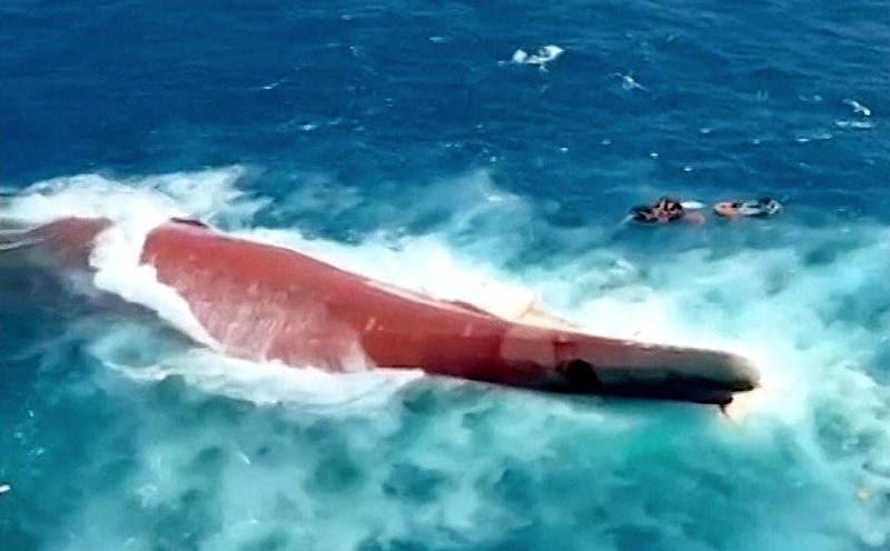 Indonesia rescuers battle turbulent seas in search for 129 people after passenger ship capsizes