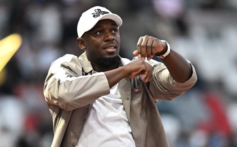 Bolt unfazed by robot's record run, eyes Manchester derby instead