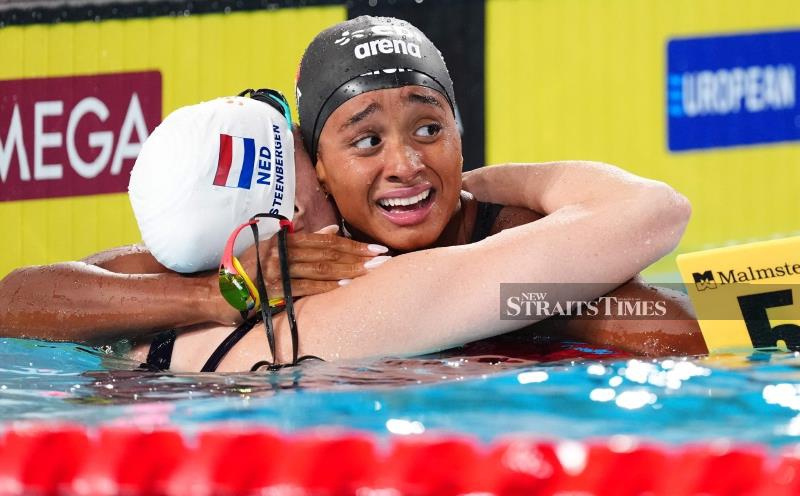 Italy's Curtis takes McKeown's 50m backstroke world record