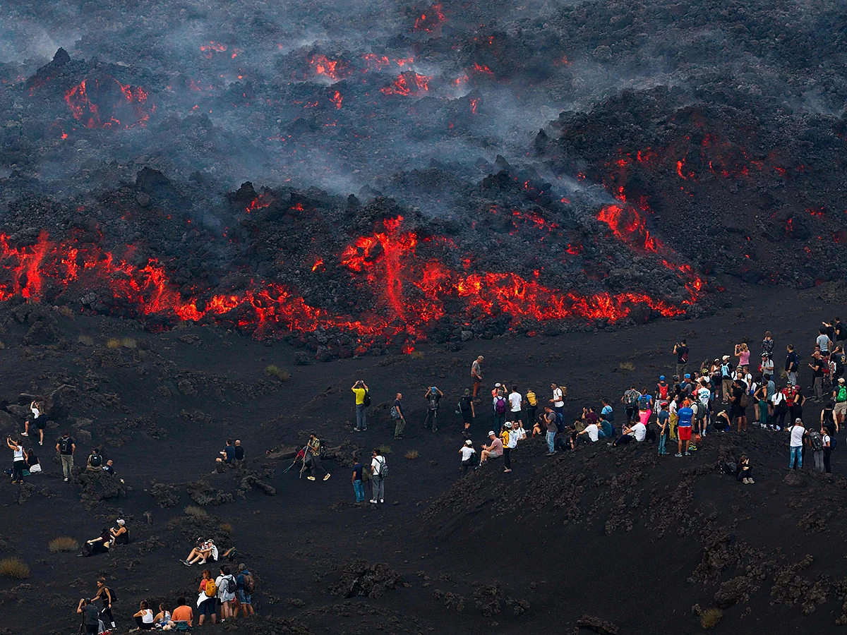 Lava spectacle draws crowds to erupting Mount Etna