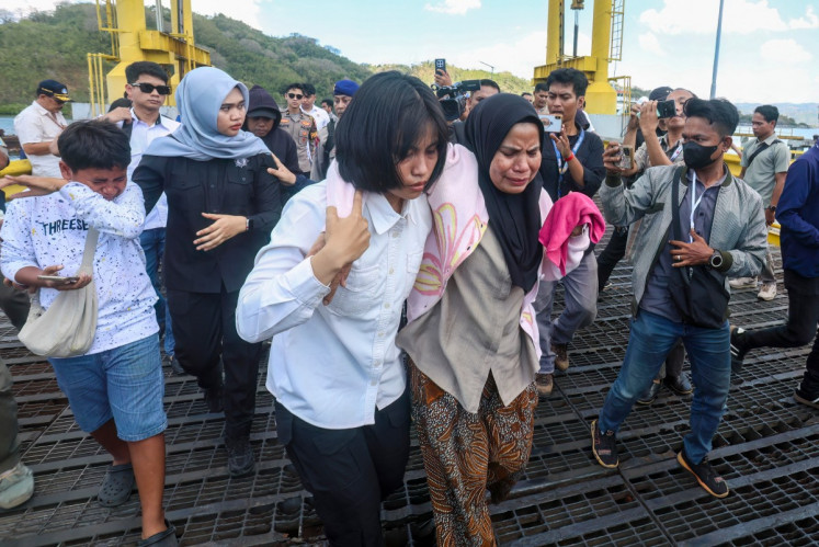 Rescuers comb waters near Bali for 5 missing after ferry blaze