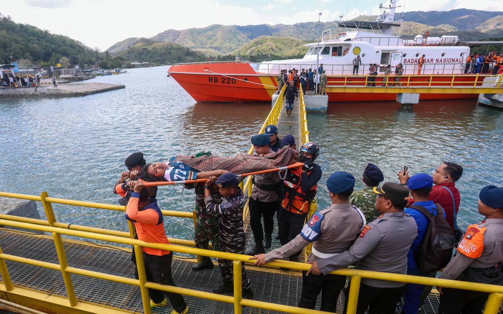 Rescuers comb waters near Bali for 5 missing after ferry blaze