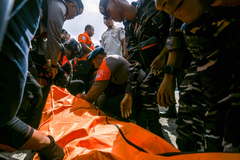 Rescuers scour Bali waters for five missing after ferry fire sends dozens scrambling overboard