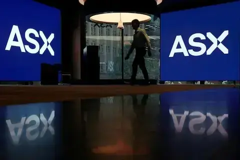 Australian shares edge lower as bank, mining losses outweigh Origin-led utility gains