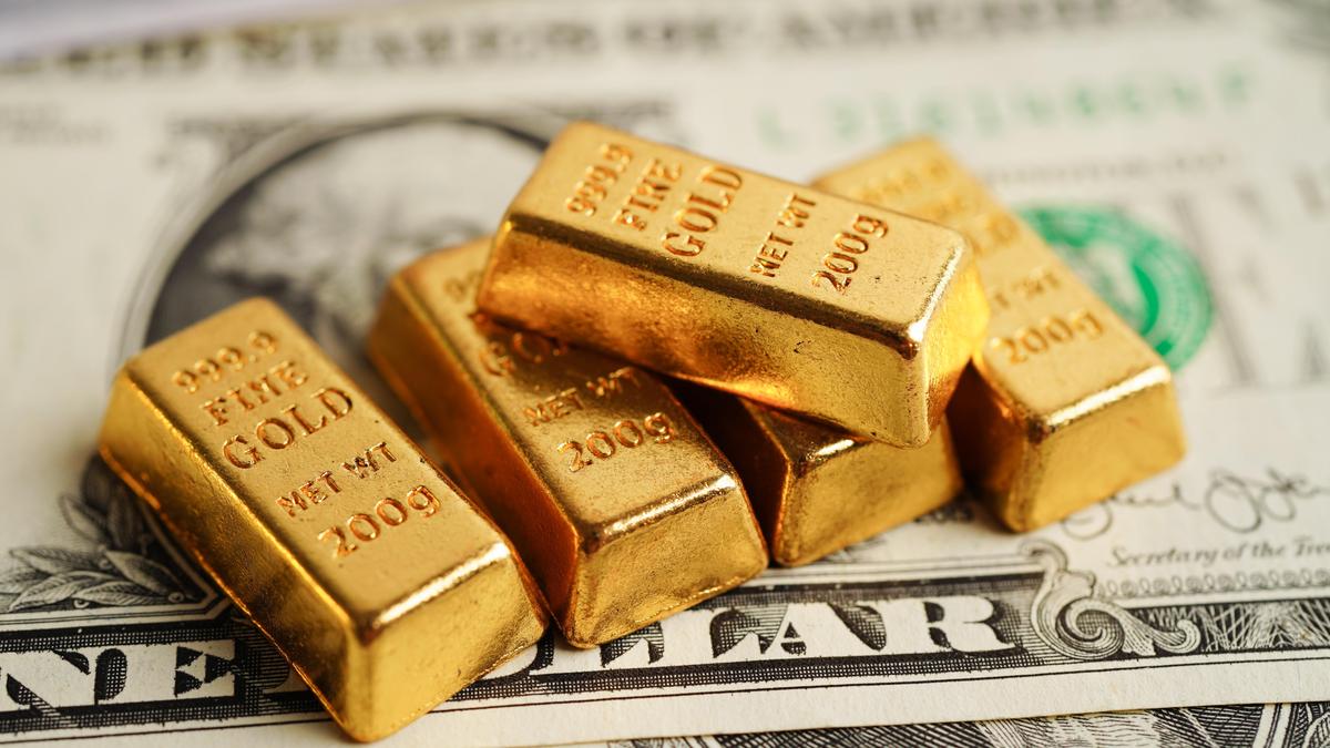 Gold touches two-month peak, then slips as traders pause for inflation cues