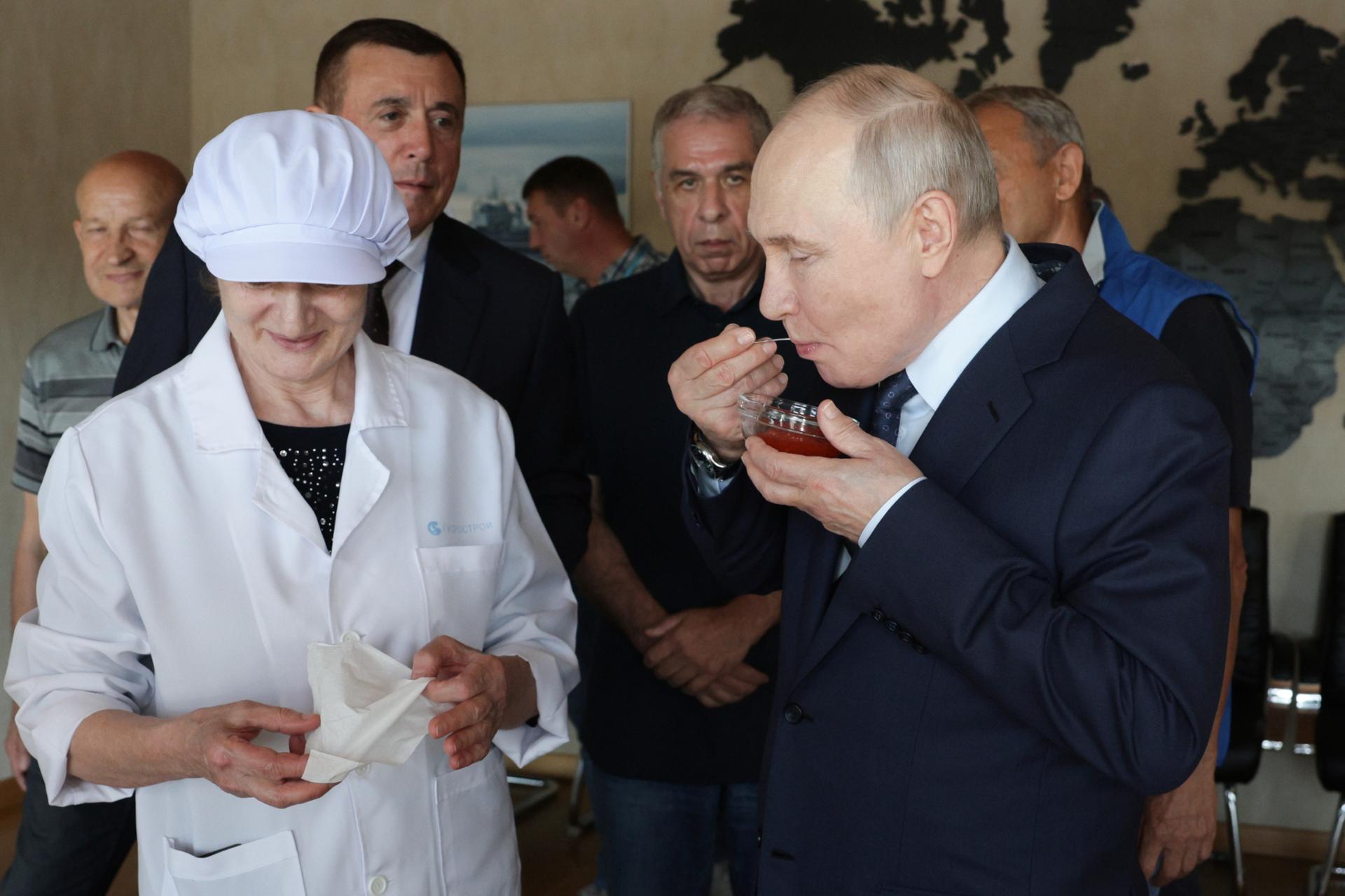 Russia's Putin visits Japan-claimed islands for first time; Tokyo protests