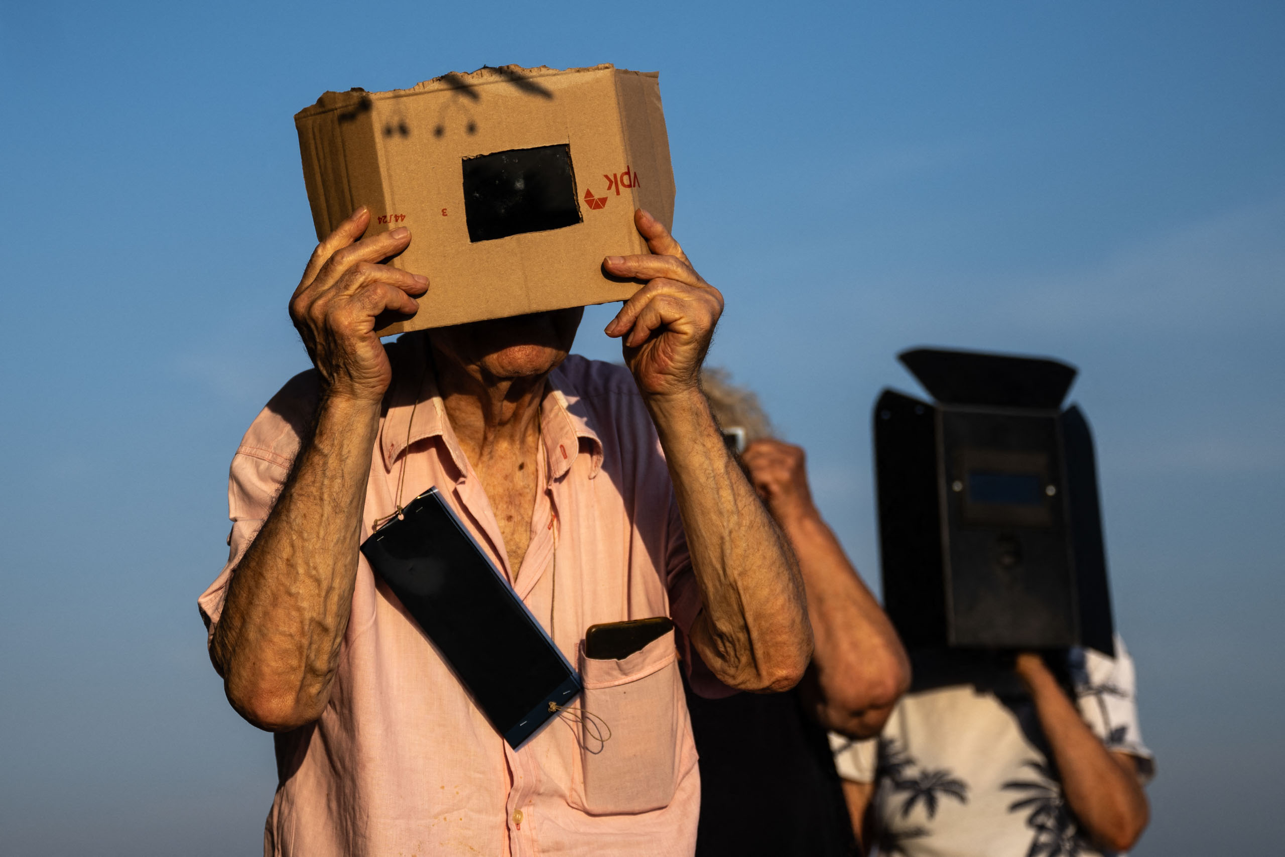 From welders-masks to makeshift pinhole cameras – there’s so many amazing photos of the eclipse, but it’s the people that I love the most