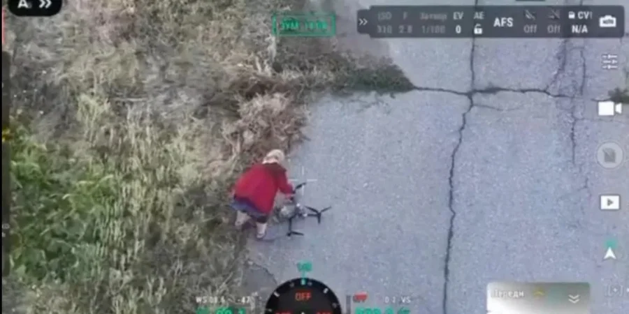 Video shows elderly Ukrainian woman disabling Russian fiber-optic waiting drone by hand