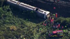 Aerial footage shows derailed train
