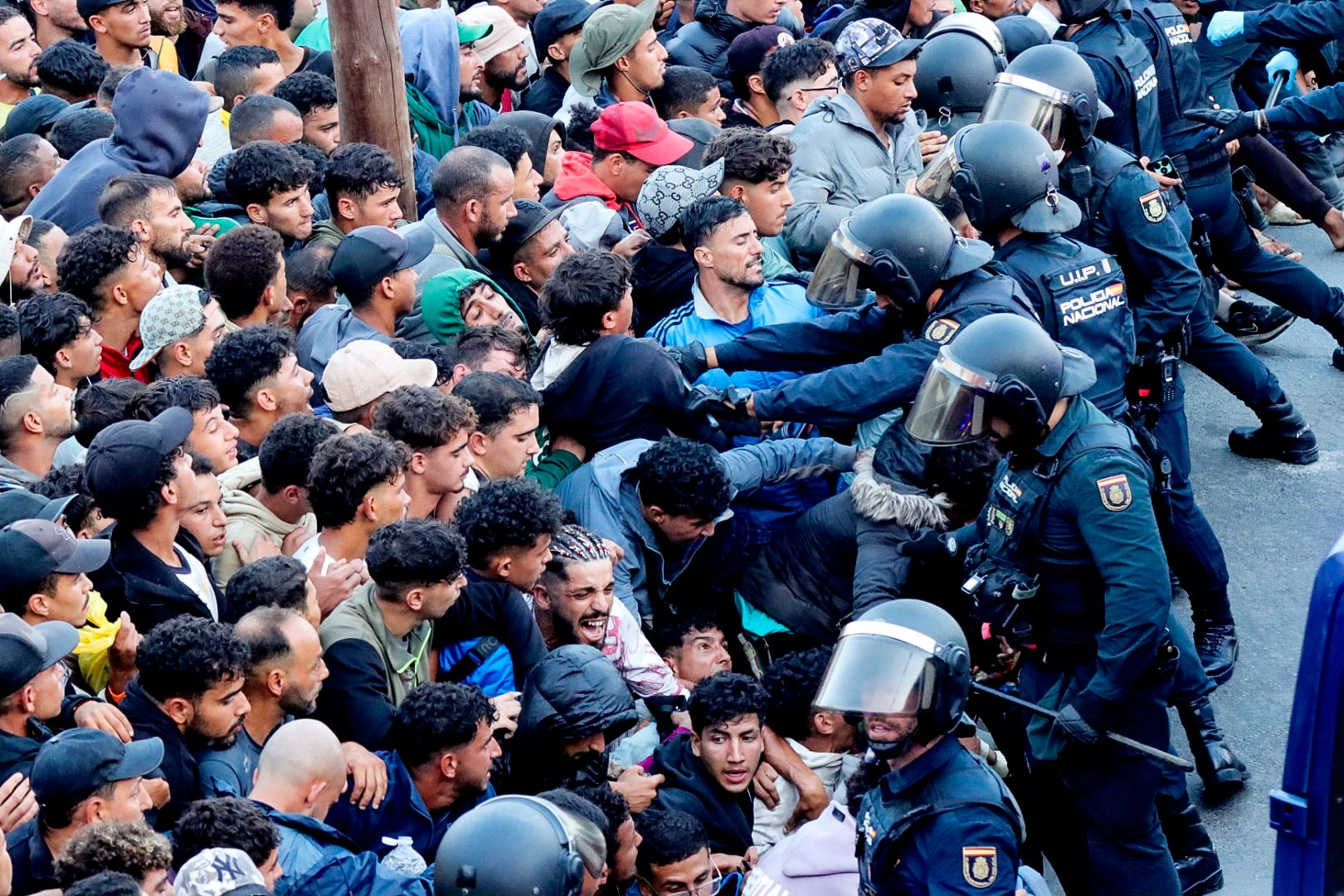 Shots fired as migrants moved to new camp in Ceuta