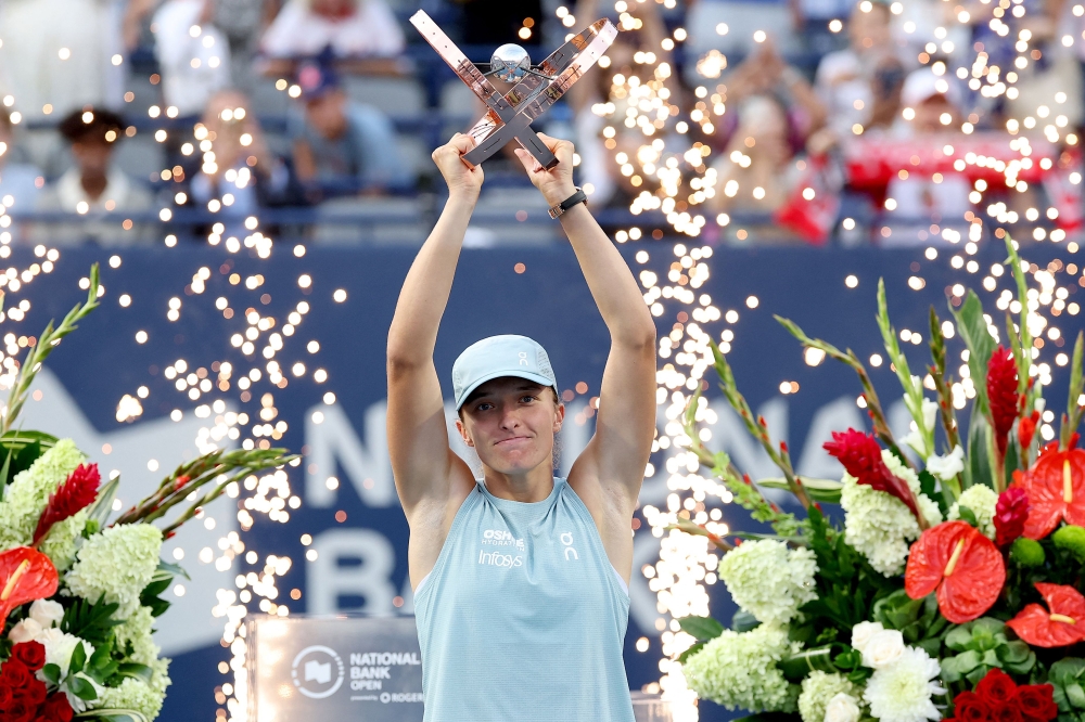 Swiatek storms past Rybakina to claim first title of year in Toronto