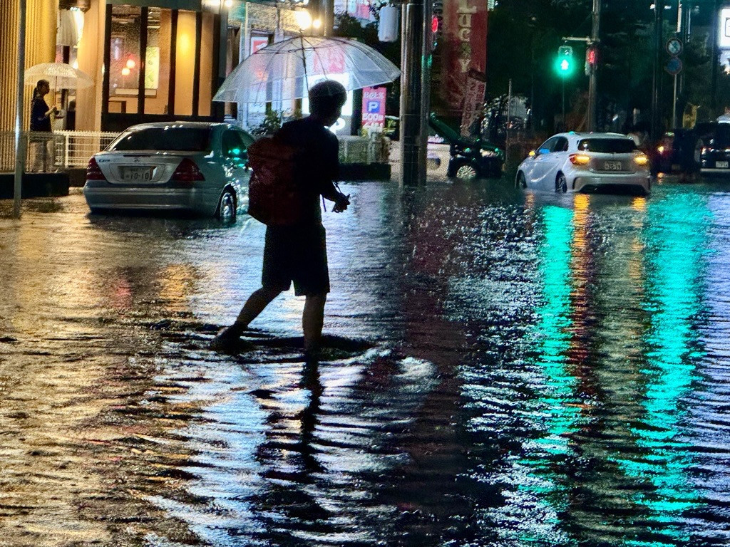 Thousands stranded at Japan’s Narita airport after record rain kills four