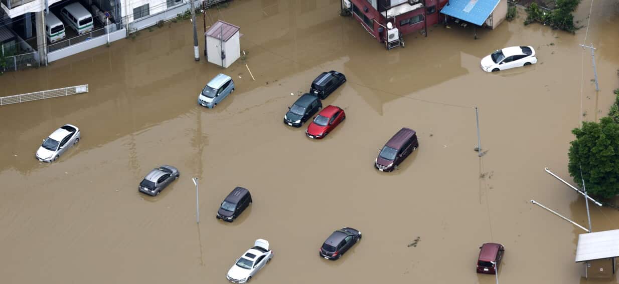 Deluge at Tokyo airport kills four and strands 7,000 as Hawaii braces for tropical storm